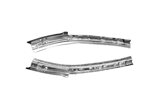 Pair of automotive bumper or reinforcement beams on white background.