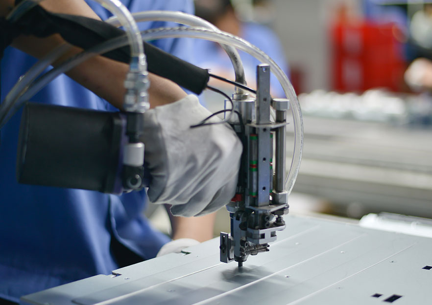 Close-up of test/inspection activity on a component or fixture.