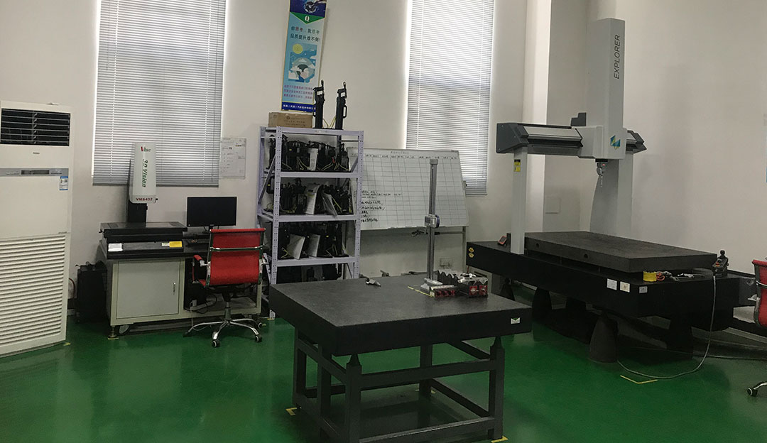 Coordinate measurement or inspection station in a lab-like room.