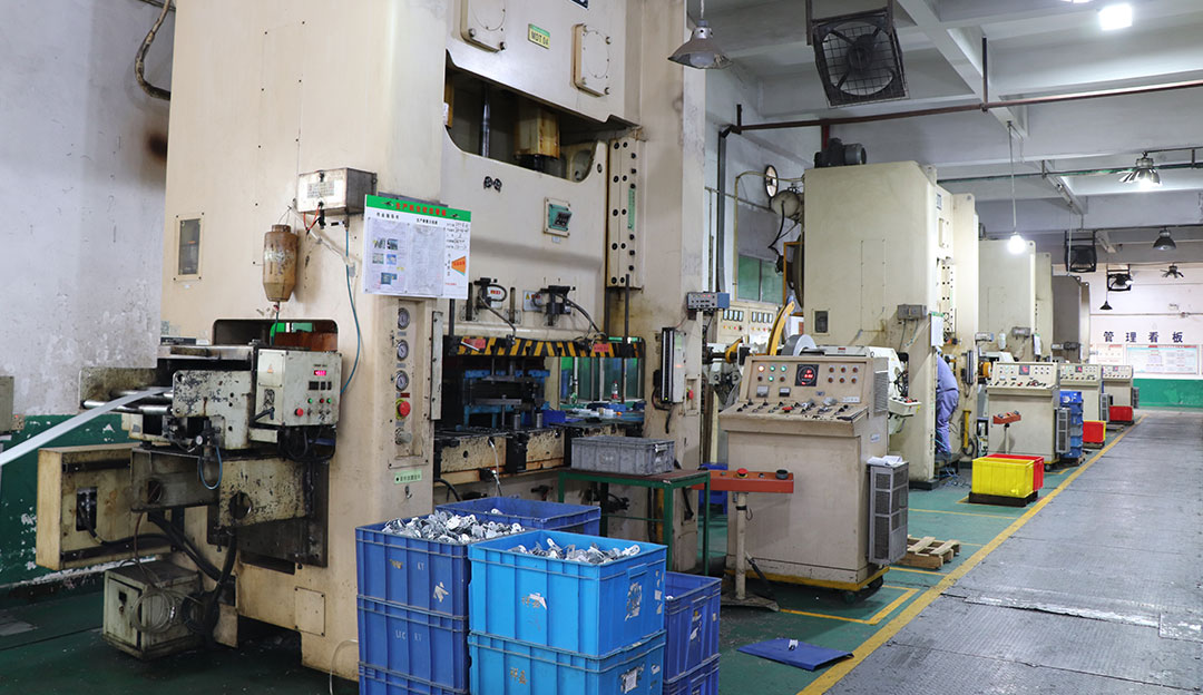 Inspection or press-side measurement station in factory area.