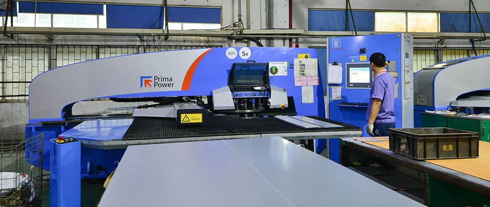 Blue CNC or laser sheet-metal processing machine handling flat metal sheet.