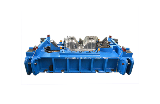 Blue large-form tooling die assembly on white background.