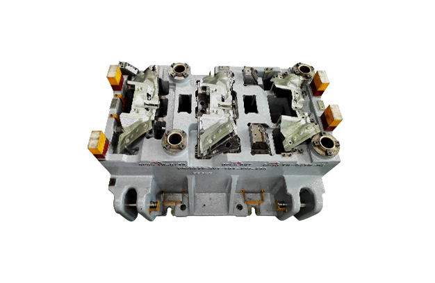 Large metal stamping die/tooling assembly on a white background.