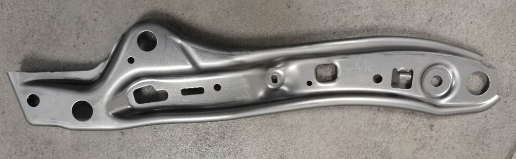 Stamped metal part example for Mexico production-fit discussions.
