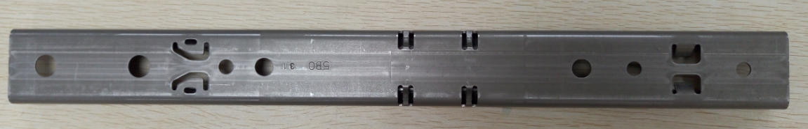 Long structural stamped metal rail example for Mexico production-fit discussions.
