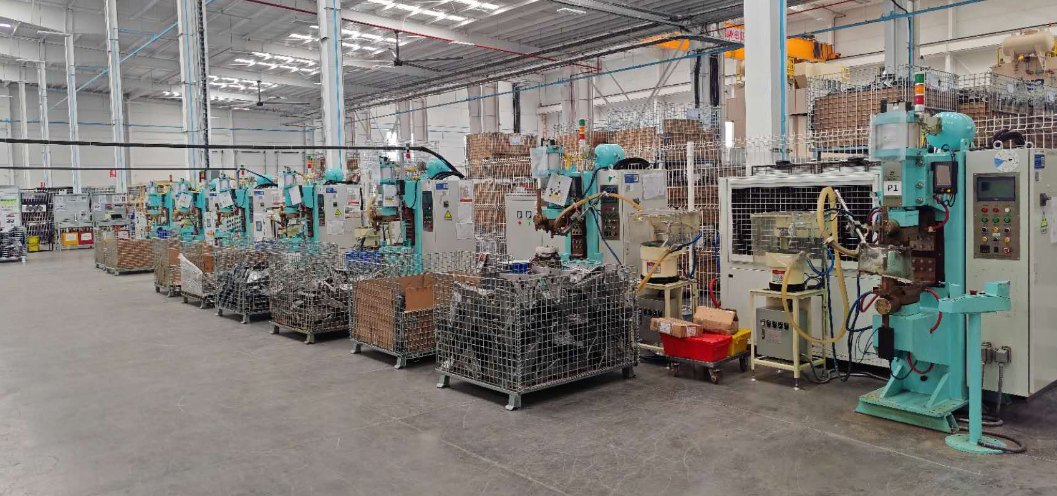 Mexico production floor with manufacturing process equipment and material handling.